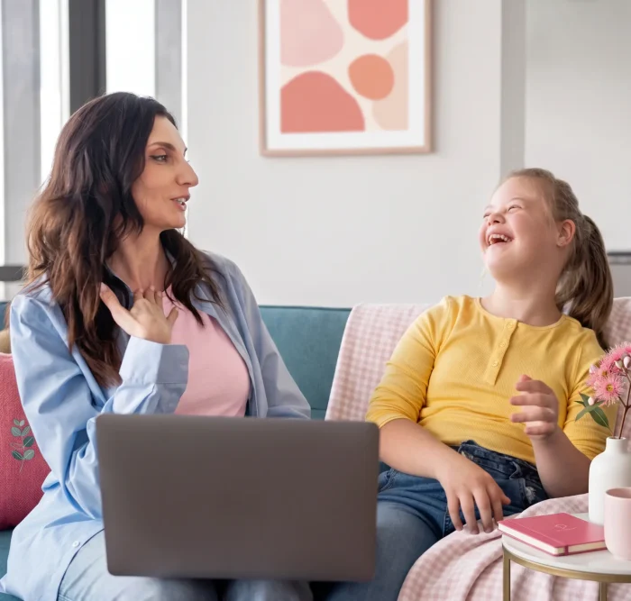 expert giving the Behaviour Support to young girl with down syndrome