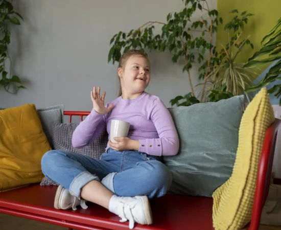 full shot disable girl sitting indoors